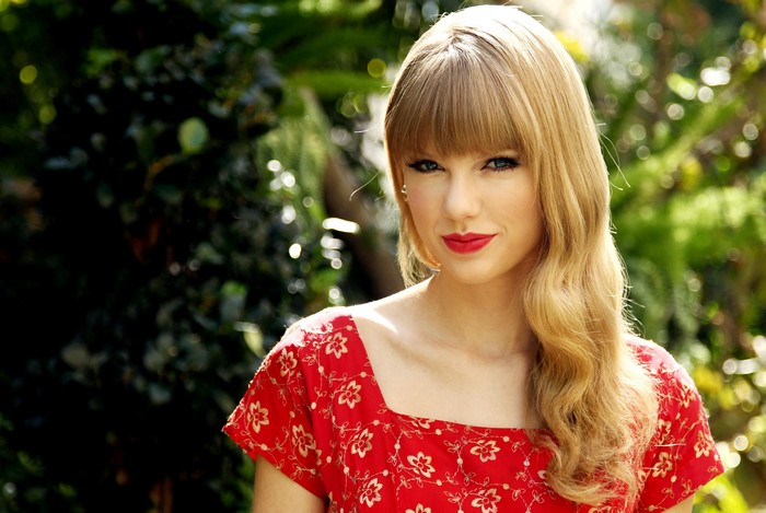 Taylor Swift in a red floral dress
