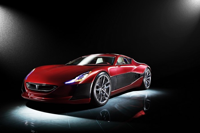 Red Rimac Concept car on a reflective surface