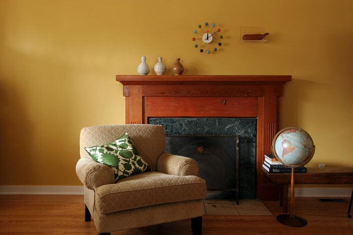 Living room with armchair and fireplace