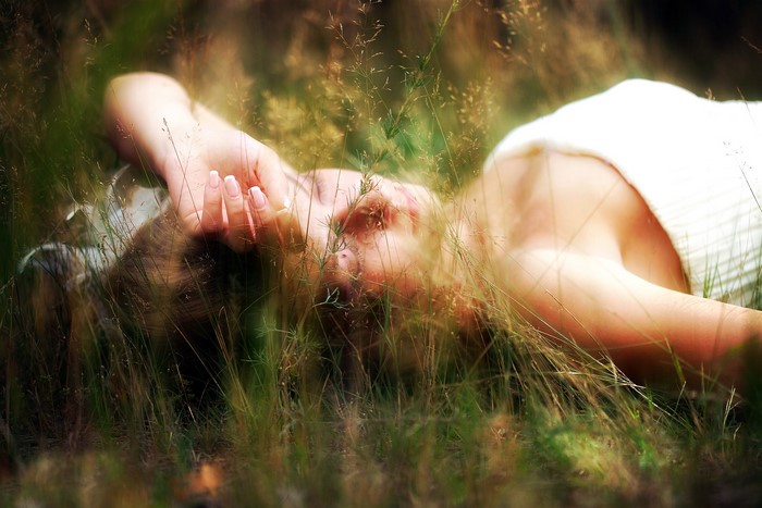 Woman lying in grass