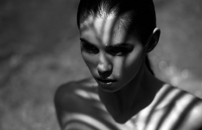 Woman with shadow play on face