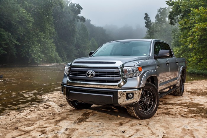 Silver Toyota Tundra parked by a river