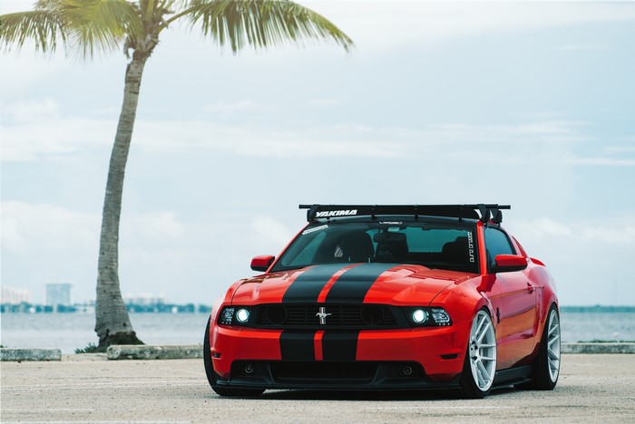 Red Ford Mustang with Black Stripes and Roof Rack