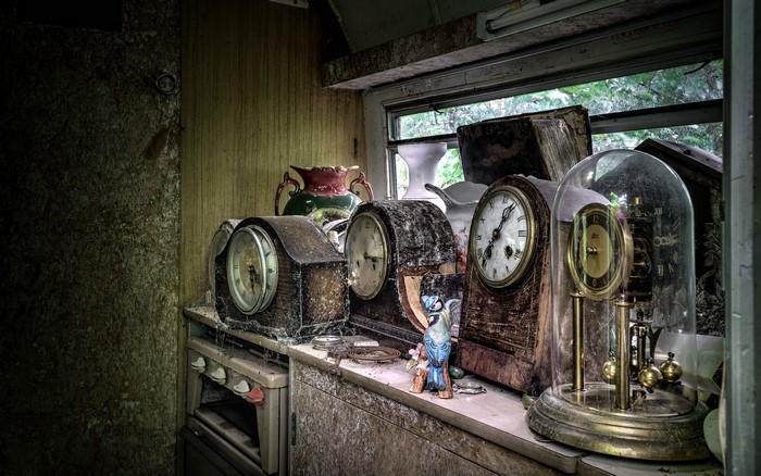 Collection of antique clocks on a shelf