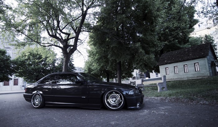 Black BMW E36 parked on a street