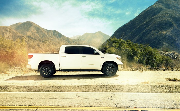 White Toyota Tundra parked on a dirt road