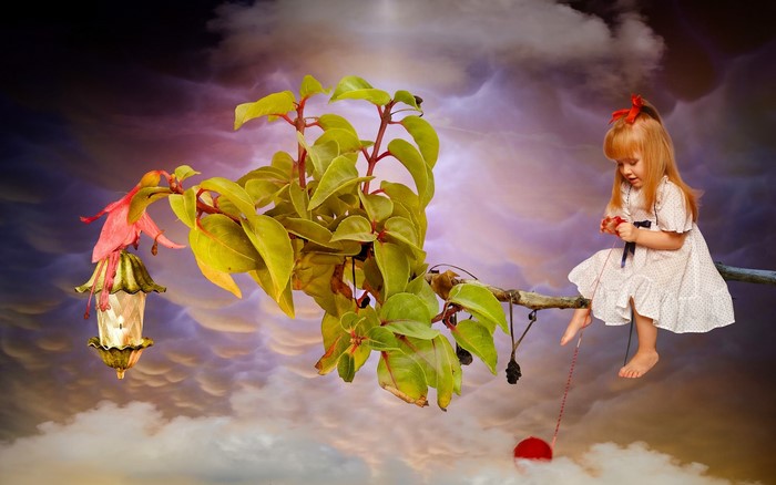 Girl on a branch with a lantern and yarn