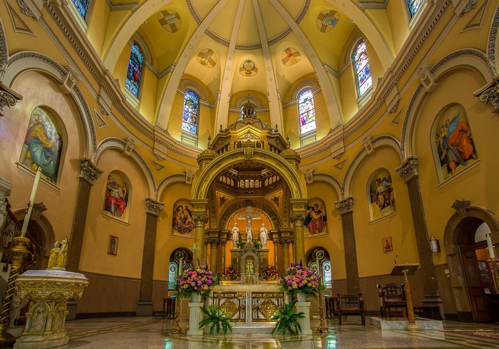 Interior of a church with altar and stained glass windows