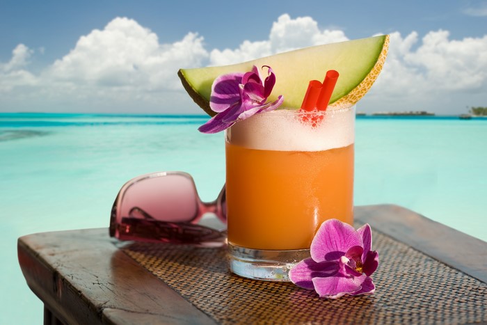 Tropical Cocktail with Melon and Orchid by the Ocean