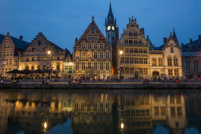 Ghent, Belgium: Historic buildings reflected in a river at night