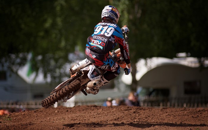 Motocross rider #919 Watson in mid-air jump