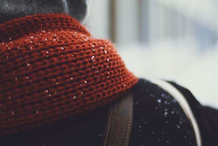 Close-up of a person wearing a red scarf in winter