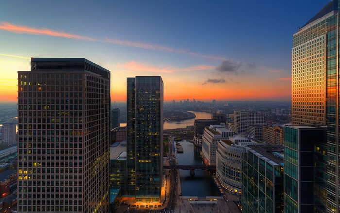 London skyline at sunset with skyscrapers and river