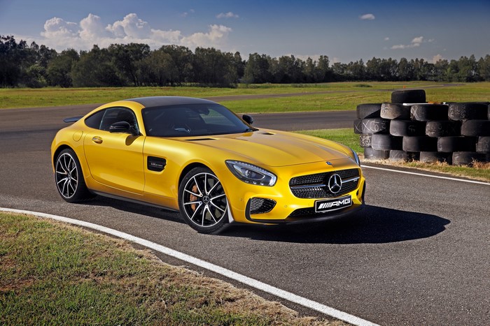 Yellow 2015 Mercedes-Benz AMG GT S on a Racetrack