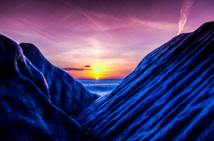 4K Sunset over the Sea between Mountains