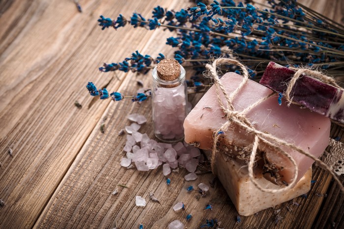 Lavender soaps and bath salts on wooden background