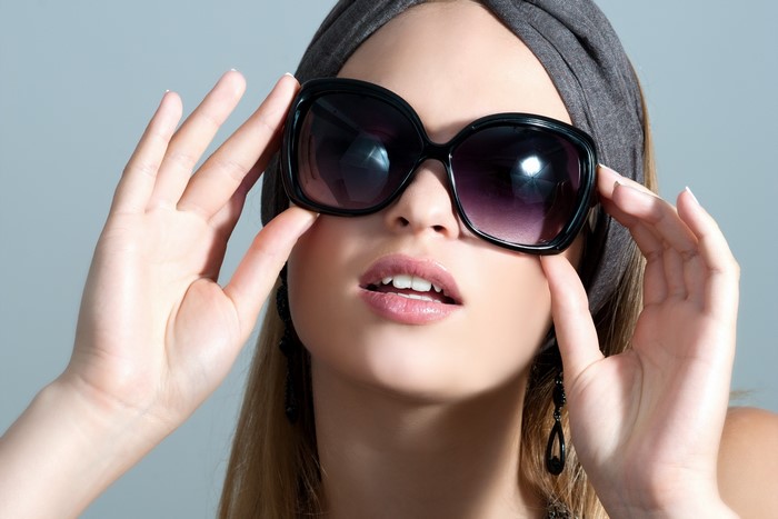 Woman wearing sunglasses and headband