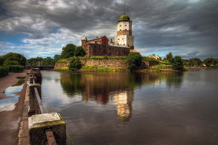 Vyborg Castle on a rocky island with a cloudy sky