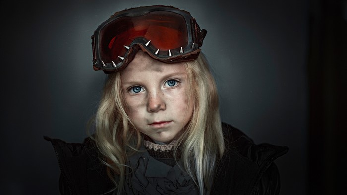 Girl with goggles and dirty face