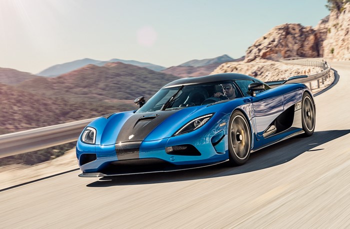 Blue 2015 Koenigsegg Agera HH driving on a mountain road