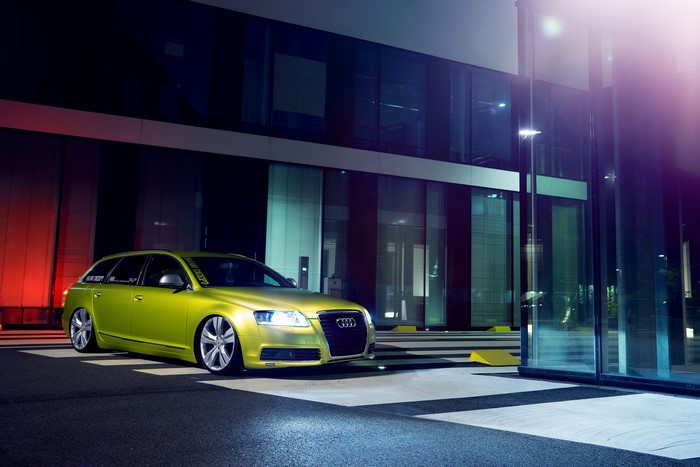 Lime green Audi A6 Avant low stance at night