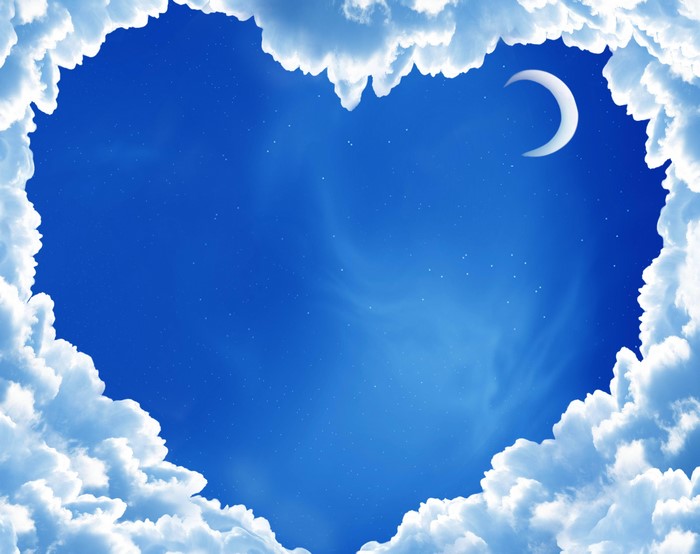 Heart shaped clouds with crescent moon in night sky