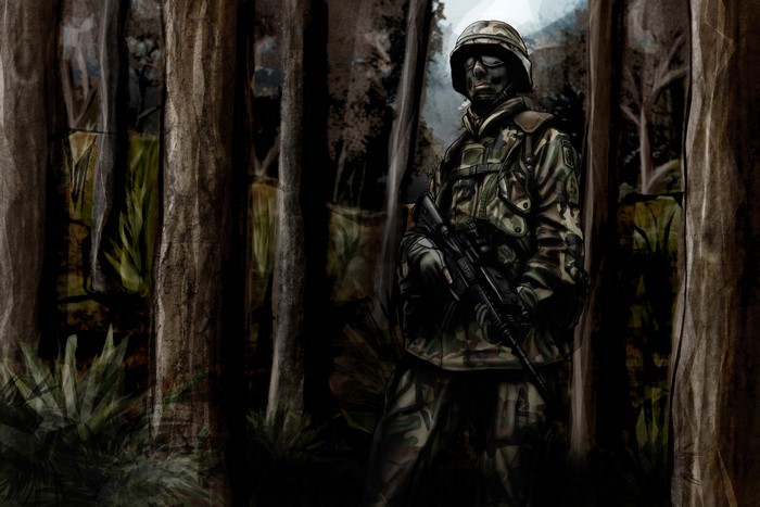 Soldier in camouflage in a forest