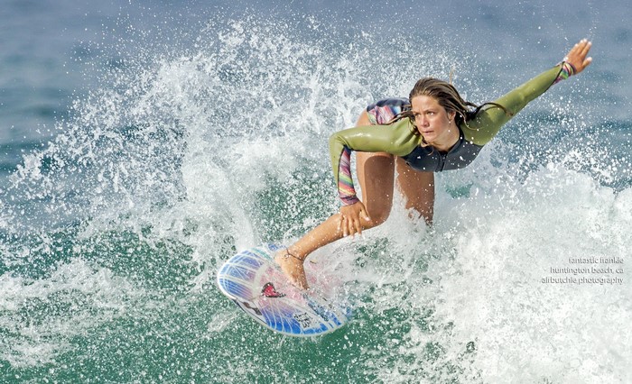 Surfer riding a wave in Huntington Beach
