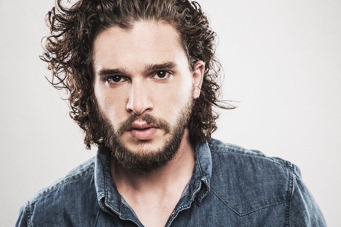 Kit Harington with beard and curly hair