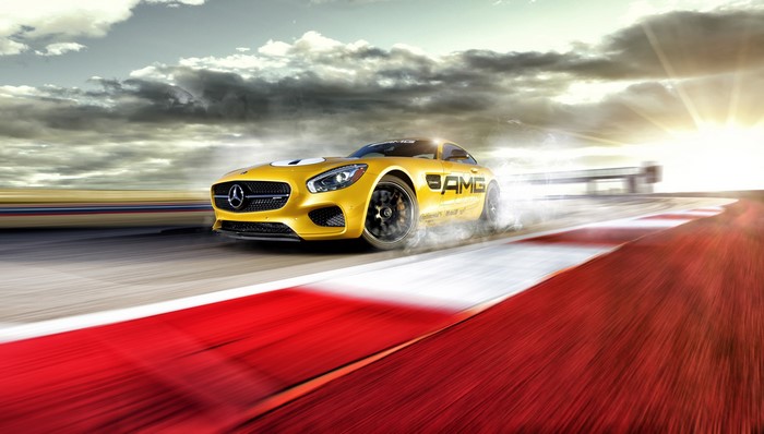 Yellow Mercedes-Benz AMG GT S drifting on a race track