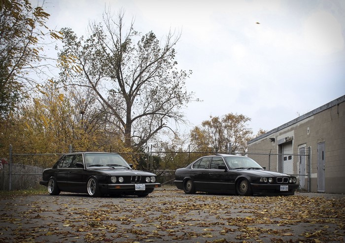 Two black BMW E28 and E34 sedans