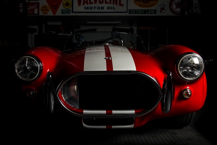 Red Cobra car with white stripes