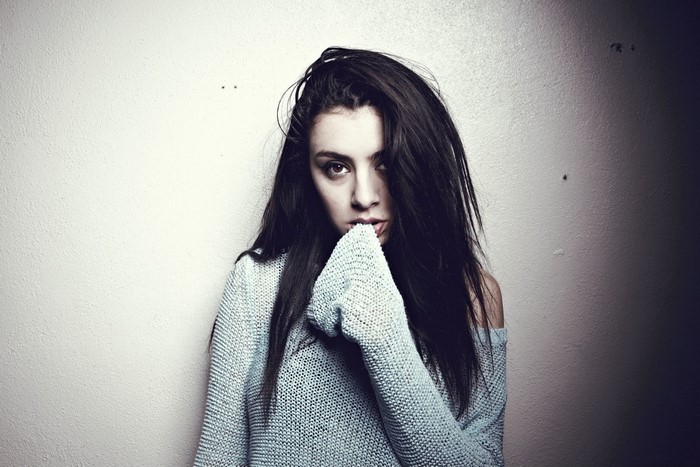 Brunette girl in a light blue sweater