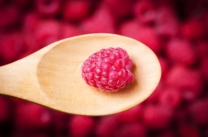 Raspberry on a wooden spoon