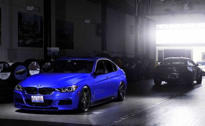 Blue BMW 335i F30 in a garage