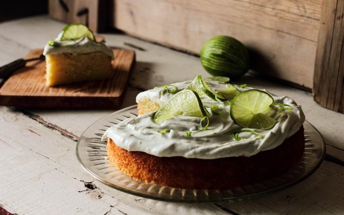 Lime cake with whipped cream and lime slices