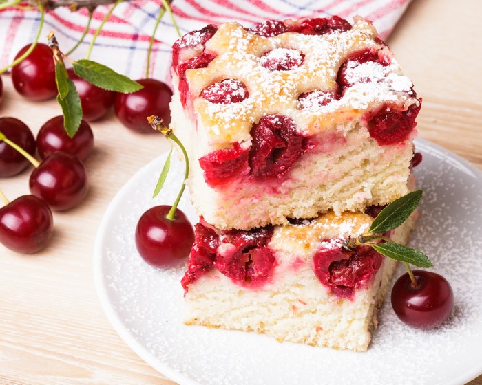 Cherry pie slices dusted with powdered sugar