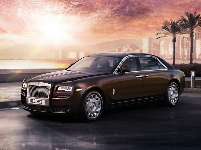 Rolls-Royce Ghost parked by the water at sunset