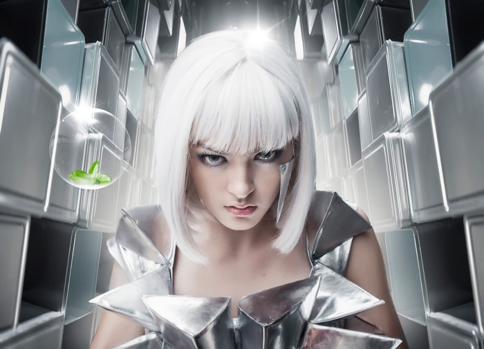 Woman with white hair in futuristic silver armor