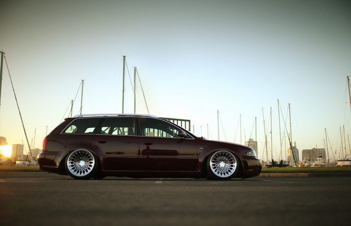 Audi RS4 Avant wagon parked by a marina