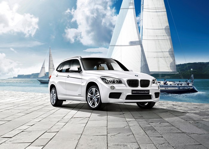 White BMW X1 Exclusive Sport with Sailboats