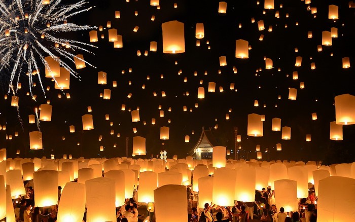 Floating Lanterns and Fireworks at Night