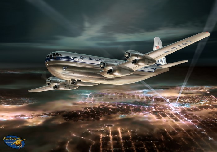 Pan Am Boeing 377 Stratocruiser flying over a city at night
