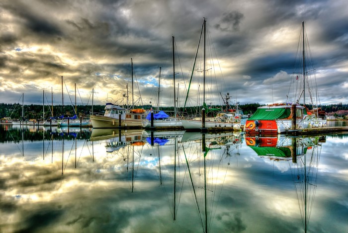 Boats docked at Poulsbo Marina, Washington under cloudy sky
