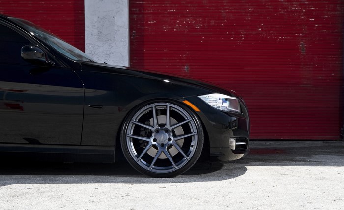 Black BMW E90 with custom wheels