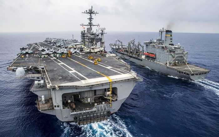 USS George Washington (CVN 73) and supply ship at sea