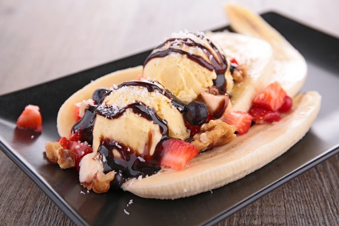 Banana split dessert with ice cream and strawberries