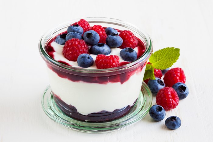 Cream yoghurt dessert with raspberries and blueberries