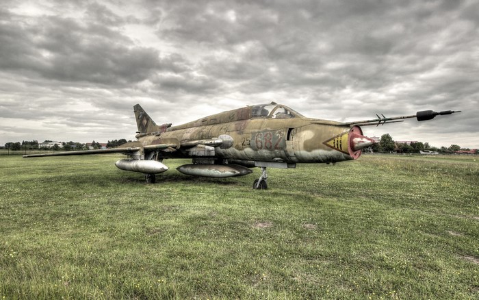 Old Mig II airplane on grass field