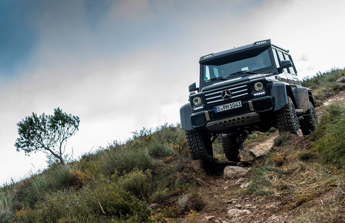 Mercedes-Benz G500 4x4 off-roading on a rocky hill